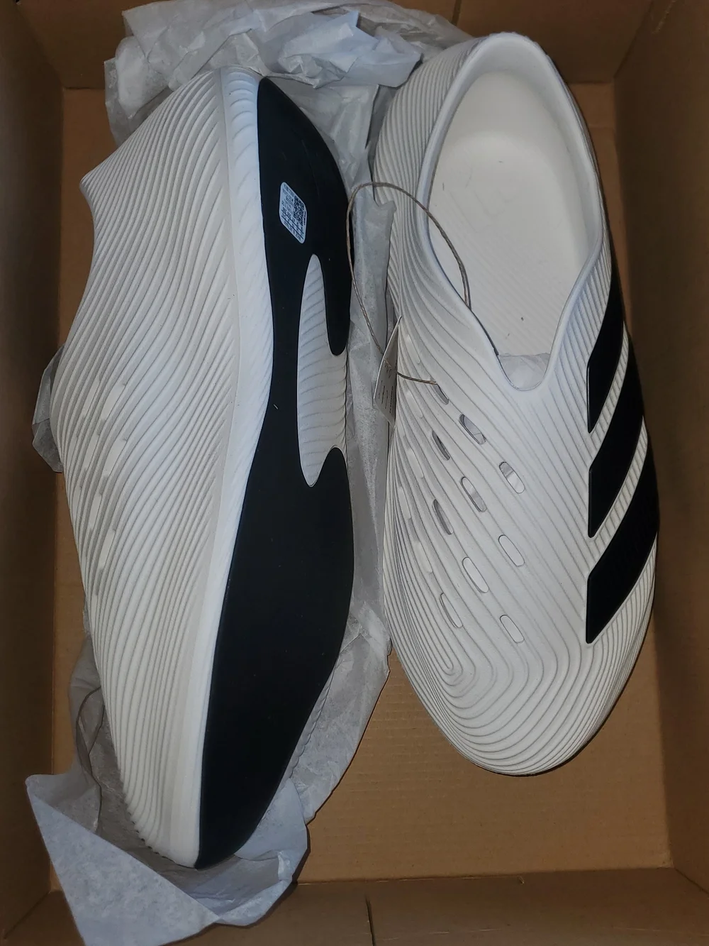 Adidas Men's White Slip-On Athletic Shoes with Black Accents